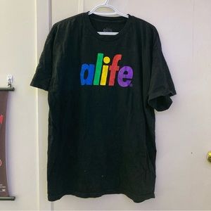 Thrifted vintage black graphic tee with rainbow text in men’s extra large